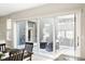 Patio area with outdoor furniture visible through the sliding glass door, leading to indoor dining space at 7152 Cherry Creek Blvd, Carmel, IN 46033