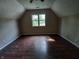 Spacious attic bedroom with hard wood floors and ceiling fan at 764 Haugh St, Indianapolis, IN 46222