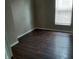 The bedroom features dark wood flooring and a window for natural light at 764 Haugh St, Indianapolis, IN 46222