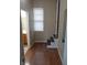 Hardwood hallway features an open door to bath and stair access at 764 Haugh St, Indianapolis, IN 46222