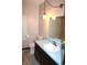 Bathroom with wood cabinets, neutral paint, sink, and tile floors at 7931 Guion Rd, Indianapolis, IN 46268