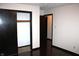 Bedroom featuring wood floors and a walk in closet with easy access to other rooms at 7931 Guion Rd, Indianapolis, IN 46268