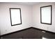 Bedroom featuring wood floors and natural light with two windows and neutral paint at 7931 Guion Rd, Indianapolis, IN 46268