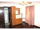 Main bedroom with hardwood floors and en-suite bathroom with vanity and shower at 7931 Guion Rd, Indianapolis, IN 46268