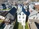 An aerial view displays the home's location, backyard patio, and hot tub at 811 E Minnesota St, Indianapolis, IN 46203