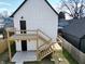 A view of the backyard deck with stairs leading down to the cozy outdoor space of the property at 811 E Minnesota St, Indianapolis, IN 46203