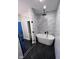 Modern bathroom features a soaking tub, glass-enclosed shower and decorative tile wall at 811 E Minnesota St, Indianapolis, IN 46203