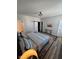 Bright bedroom with light gray walls, sliding barn door, and hardwood floors at 811 E Minnesota St, Indianapolis, IN 46203