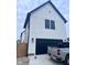 Detailed view of the exterior featuring sleek black accents and a convenient black garage door at 811 E Minnesota St, Indianapolis, IN 46203
