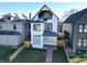 Charming two-story home featuring a sleek design, ample natural light, and a welcoming front entrance at 811 E Minnesota St, Indianapolis, IN 46203