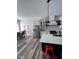 A modern kitchen featuring stainless steel appliances, white cabinets, and an open layout for dining at 811 E Minnesota St, Indianapolis, IN 46203