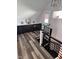 Chic upstairs landing with a wet bar, sleek black cabinets, and a convenient beverage fridge at 811 E Minnesota St, Indianapolis, IN 46203