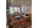 The living room showcases a stone fireplace, large windows, and stylish neutral furniture, enhancing the space at 811 E Minnesota St, Indianapolis, IN 46203