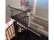 Modern staircase with black metal railing and hardwood floors leading to an upstairs landing with a desk at 811 E Minnesota St, Indianapolis, IN 46203