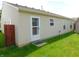 Home's backyard featuring well-maintained lawn, and bright siding at 8346 Weathervane Cir, Indianapolis, IN 46239