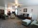 Spacious living room with large windows, neutral paint, and plenty of room for seating arrangements at 8346 Weathervane Cir, Indianapolis, IN 46239