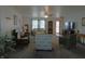 Large living room, neutrally painted, with ceiling fan and access to other living areas at 8346 Weathervane Cir, Indianapolis, IN 46239