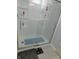 Tiled shower with glass door, built-in shelving, and sleek fixtures at 8346 Weathervane Cir, Indianapolis, IN 46239