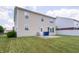 A well-maintained backyard features a concrete patio and lush lawn, creating an ideal outdoor living space at 8710 N Aspen Way, McCordsville, IN 46055