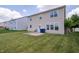 A well-maintained backyard features a concrete patio and lush lawn, creating an ideal outdoor living space at 8710 N Aspen Way, McCordsville, IN 46055