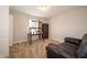 Cozy room with a desk, leather couch, and natural light from the window at 8710 N Aspen Way, McCordsville, IN 46055