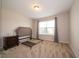 Bright and airy bedroom featuring soft carpet and natural light from the window at 8710 N Aspen Way, McCordsville, IN 46055