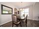 Dining room with a large table, six chairs, a mirror, and a window at 8710 N Aspen Way, McCordsville, IN 46055