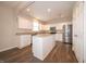 Spacious kitchen featuring white cabinetry, granite countertops, stainless steel appliances, and a convenient center island at 8710 N Aspen Way, McCordsville, IN 46055