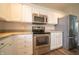 Kitchen with granite countertops, stainless steel appliances, and white cabinets creates a modern cooking experience at 8710 N Aspen Way, McCordsville, IN 46055