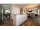 Modern kitchen featuring a center island, stainless steel appliances, white cabinetry, and wood-look flooring at 8710 N Aspen Way, McCordsville, IN 46055