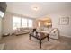 Spacious living room with comfortable sofas, a wooden coffee table, and view into the kitchen at 8710 N Aspen Way, McCordsville, IN 46055