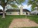 Back exterior of home with backyard. Home has vinyl siding, sliding glass doors, and chimney at 892 Millbrook Dr, Avon, IN 46123