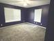 Cozy bedroom with plush carpet, large windows, and plenty of natural light at 892 Millbrook Dr, Avon, IN 46123