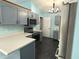 Beautifully updated kitchen featuring stainless steel appliances and gray cabinetry at 892 Millbrook Dr, Avon, IN 46123