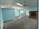 Living room with high ceilings, recessed lighting, skylight, fan, fireplace, and open wall to kitchen at 892 Millbrook Dr, Avon, IN 46123