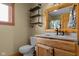 Neutral bathroom features a rustic vanity, vessel sink, and wooden shelves at 8981 N 325 E, Columbus, IN 47203