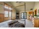Vaulted bedroom with fireplace and doors to the outdoor area at 8981 N 325 E, Columbus, IN 47203
