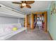 Bedroom with an open closet, bunk bed, and neutral gray walls at 8981 N 325 E, Columbus, IN 47203