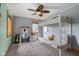 Bedroom with a bunk bed, desk area, and a ceiling fan with lights at 8981 N 325 E, Columbus, IN 47203