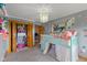 Whimsical bedroom with a bunk bed, floral decor, and an open closet at 8981 N 325 E, Columbus, IN 47203