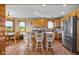 Cozy kitchen featuring light wood cabinets and stainless steel appliances with room for an eat-in dining table at 8981 N 325 E, Columbus, IN 47203