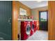 Bright laundry room featuring a red washer and dryer at 8981 N 325 E, Columbus, IN 47203