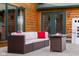 Cozy patio features wicker furniture, a fire pit table, and a playhouse at 8981 N 325 E, Columbus, IN 47203