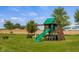 Fun backyard playground with a slide, swing set, and climbing wall for outdoor entertainment at 8981 N 325 E, Columbus, IN 47203