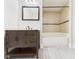 Bathroom featuring a tiled shower-tub combination and vanity at 907 S A St, Elwood, IN 46036