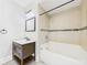 Bathroom featuring a tiled shower-tub combination and vanity at 907 S A St, Elwood, IN 46036