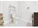 Half-bathroom featuring wood-look flooring and a toilet and sink at 907 S A St, Elwood, IN 46036
