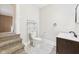 Half-bathroom featuring wood-look flooring and a toilet and sink at 907 S A St, Elwood, IN 46036