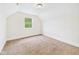 Cozy bedroom featuring natural light, carpet, and neutral colors at 907 S A St, Elwood, IN 46036