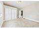 A neutral bedroom featuring a closet and door to another room at 907 S A St, Elwood, IN 46036